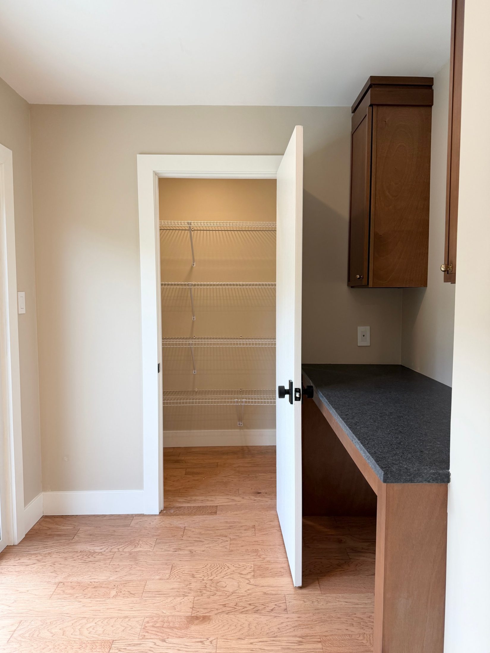 Pantry and built-in desk with a granite top